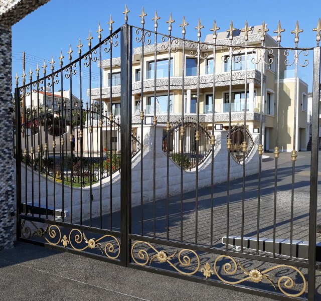 Swing gate automation system installed on exterior residential gate