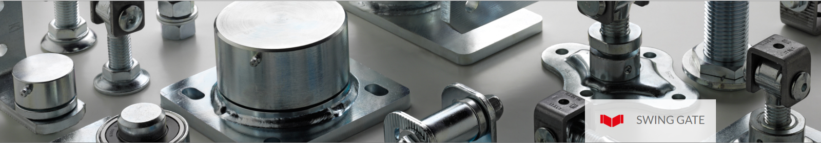 Close-up of a heavy-duty stainless steel adjustable pivot hinge for swinging gate installation.