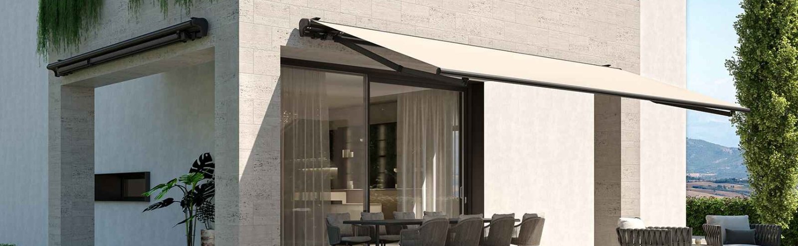 Motorized awning installed on modern house patio for outdoor shade and automation